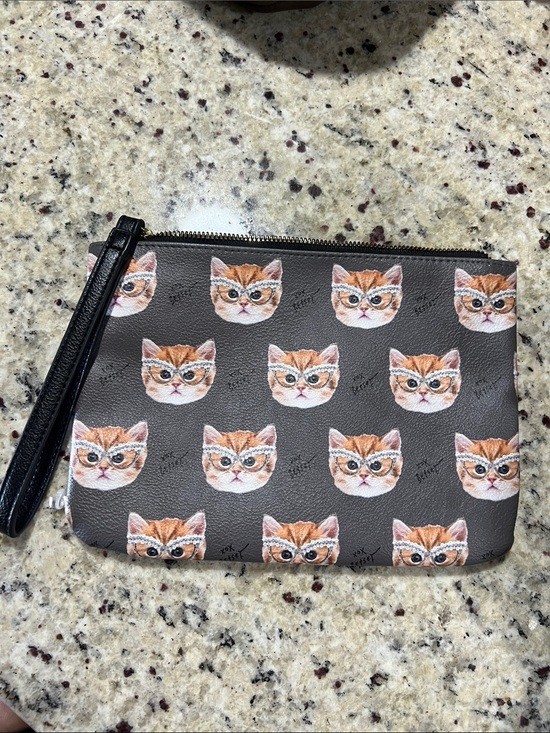 Betsey Johnson Handbags - Betsey Johnson Black Wristlet with Orange Cat Faces